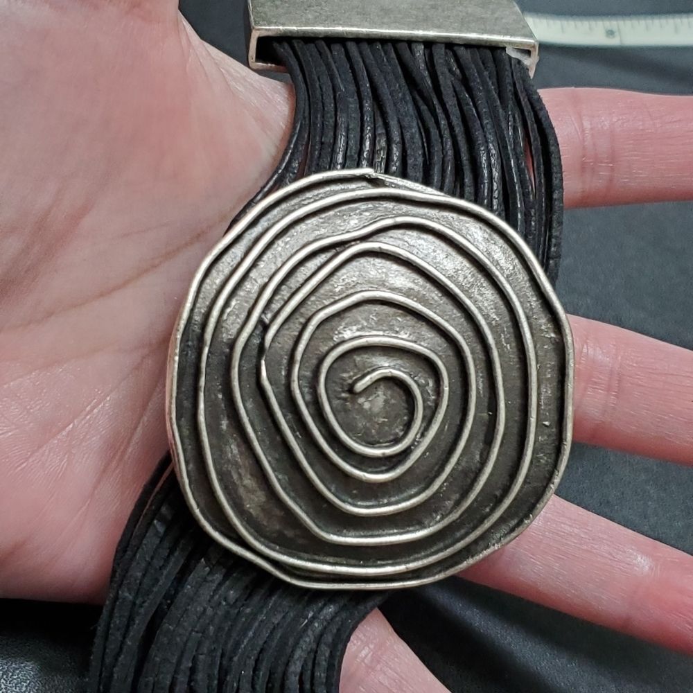 Silver tone swirl with black cord bracelet 7-9"